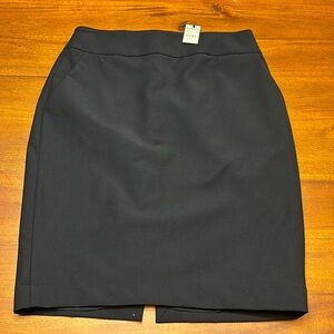 New with tags lined Express pencil skirt size 6, black. Nylon/polyester blend.